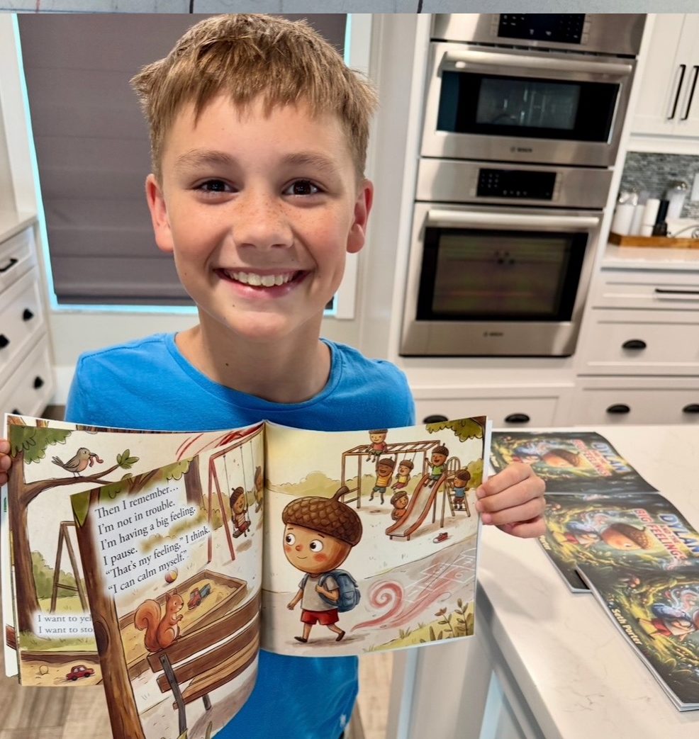 Seth smiling and holding the finished, printed book